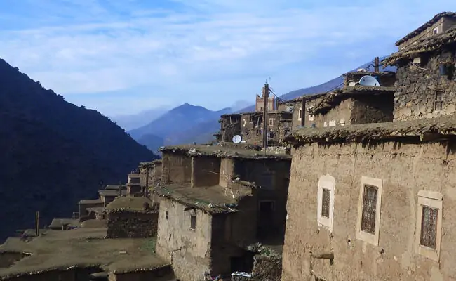 Stone houses of a Berber village on a High Atlas hillside